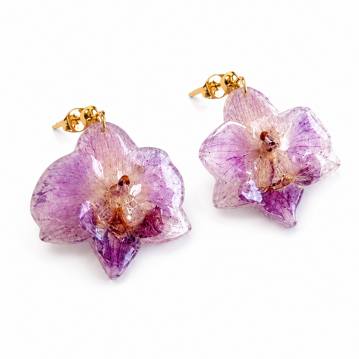 Preserved Colombian purple orchid earrings shown from an angled view